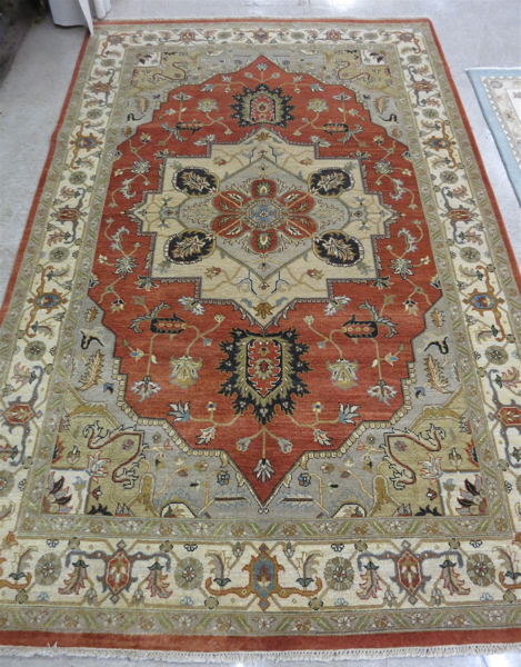 Appraisal: HAND KNOTTED ORIENTAL CARPET Persian Serapi design central geometric medallion