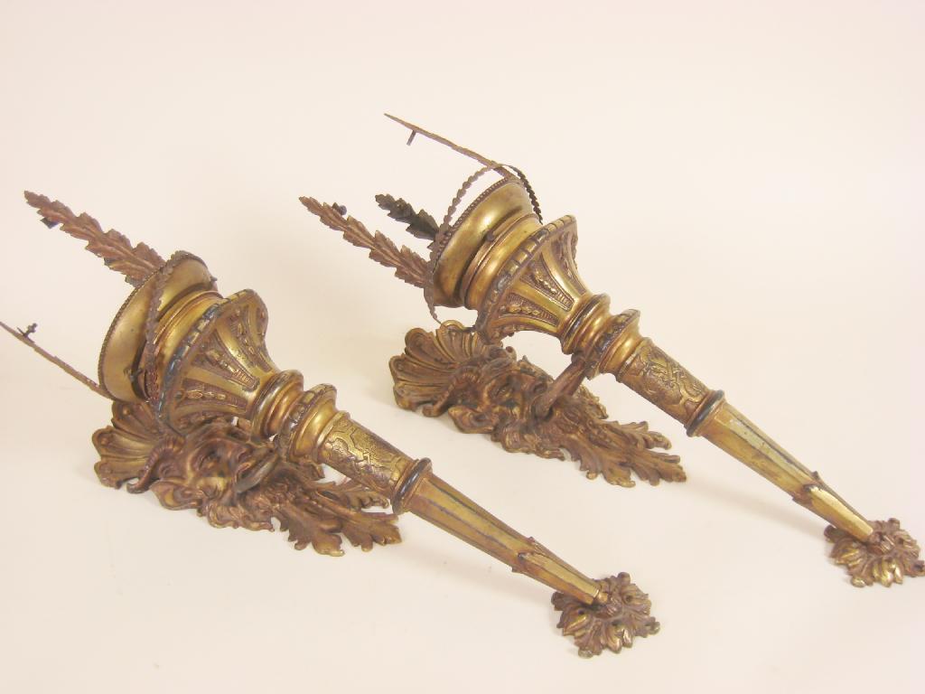 Appraisal: Pair of gilt brass Torch Wall Lights with mask backplates