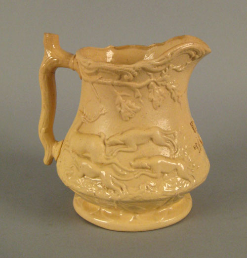 Appraisal: Staffordshire pitcher th c with relief decoration of hounds chasing