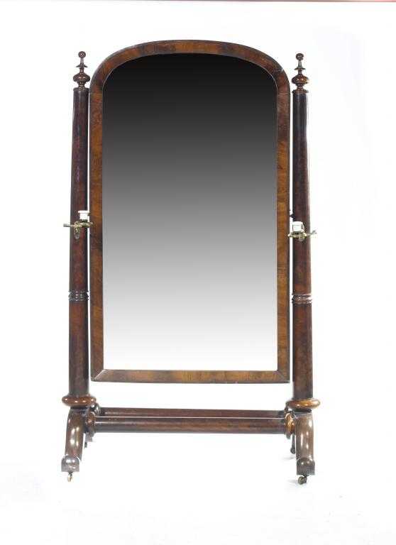 Appraisal: A VICTORIAN MAHOGANY CHEVAL MIRROR the low arched frame between