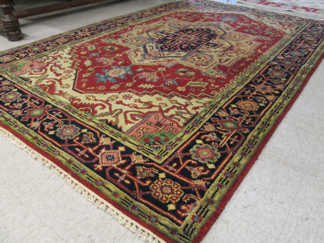 Appraisal: HAND KNOTTED ORIENTAL CARPET Persian Serapi central geometric medallion design