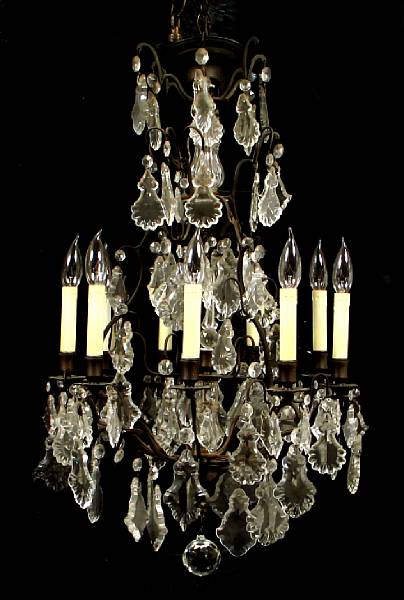 Appraisal: A Louis XV style patinated metal and crystal chandelier height