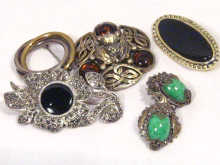 Appraisal: A mixed lot comprising four costume jewellery brooches and a