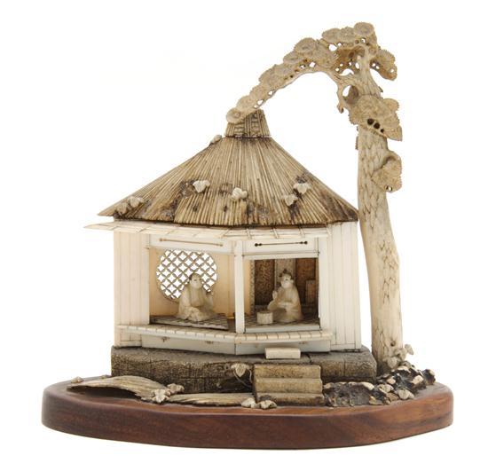 Appraisal: A Japanese Carved Ivory Tea House depicting a house with