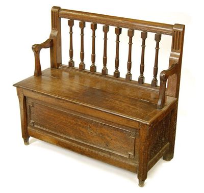 Appraisal: A continental oak hall bench with a lidded box base