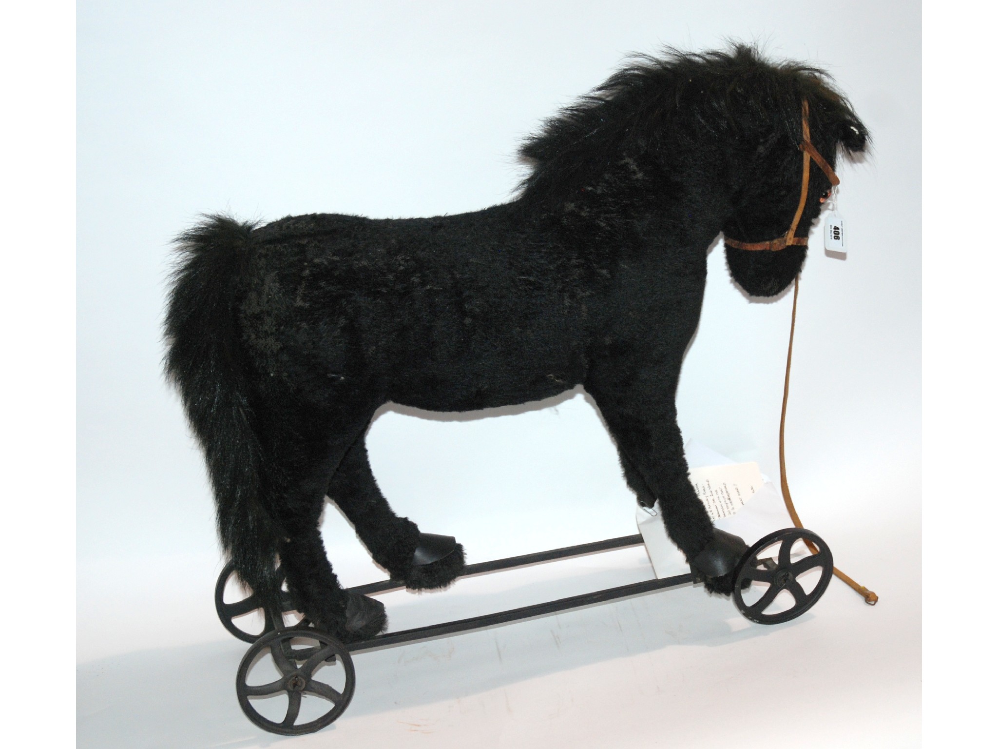 Appraisal: An early th century pony on wheels with associated letter