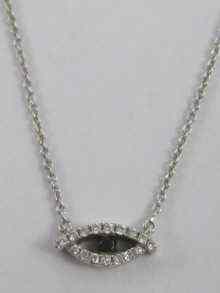 Appraisal: A white metal tests ct gold diamond and sapphire pendant