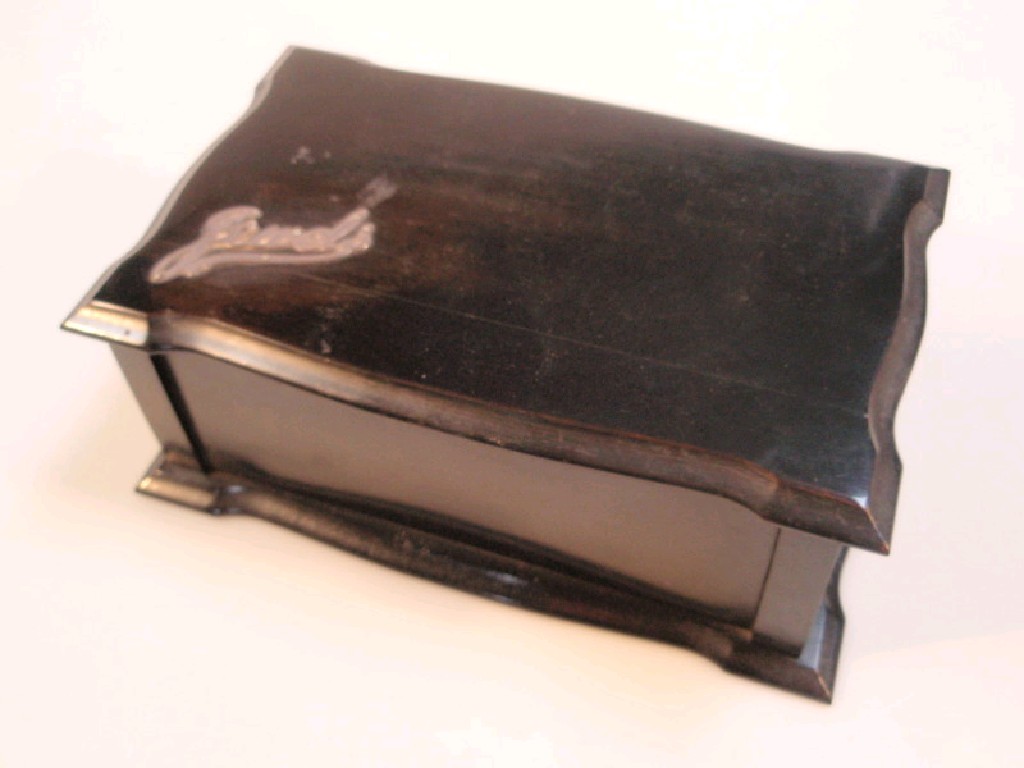 Appraisal: An Edwardian ebony jewel casket of shaped rectangular form the