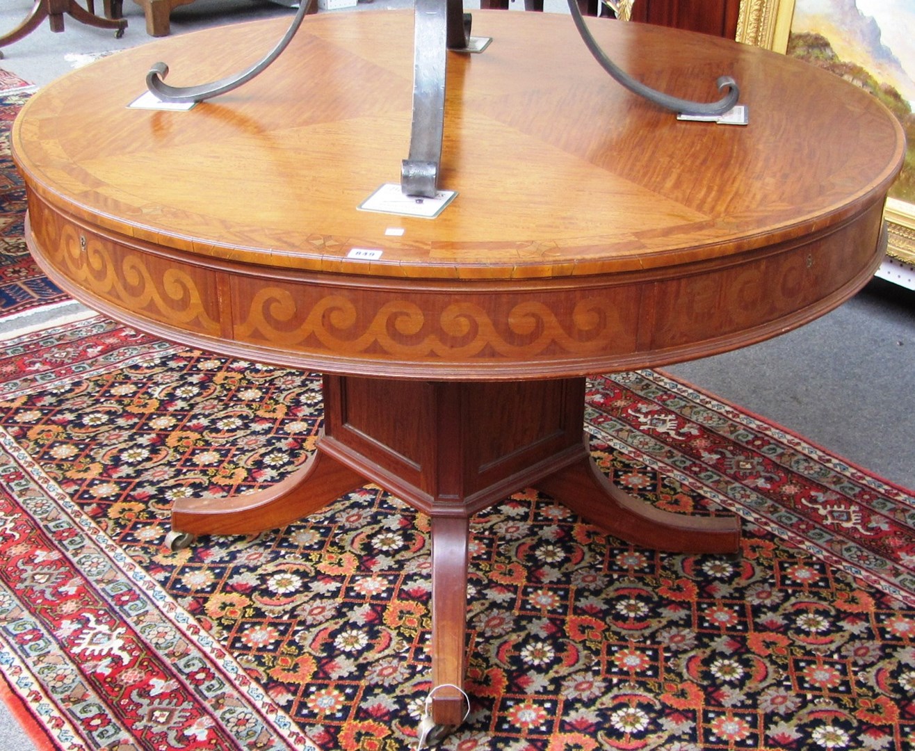 Appraisal: An Edwardian George III style inlaid satinwood drum table with