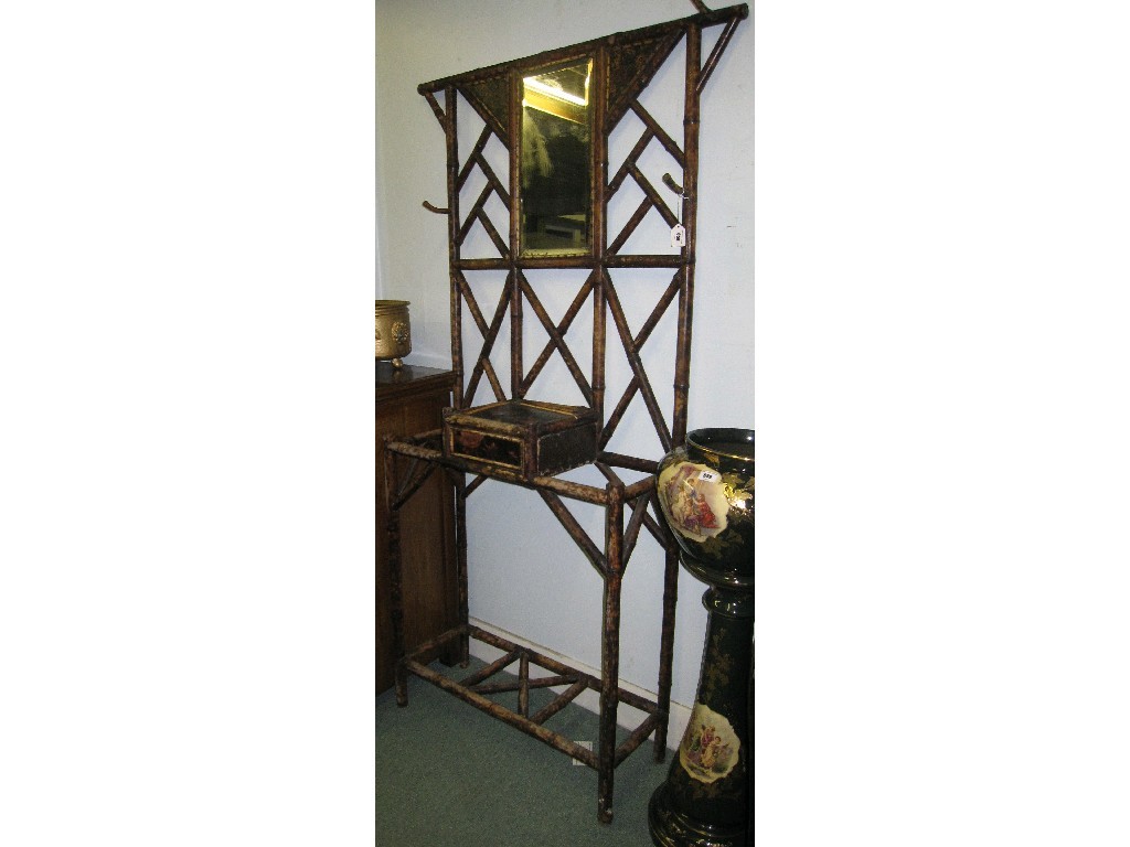 Appraisal: Bamboo mirror back hallstand