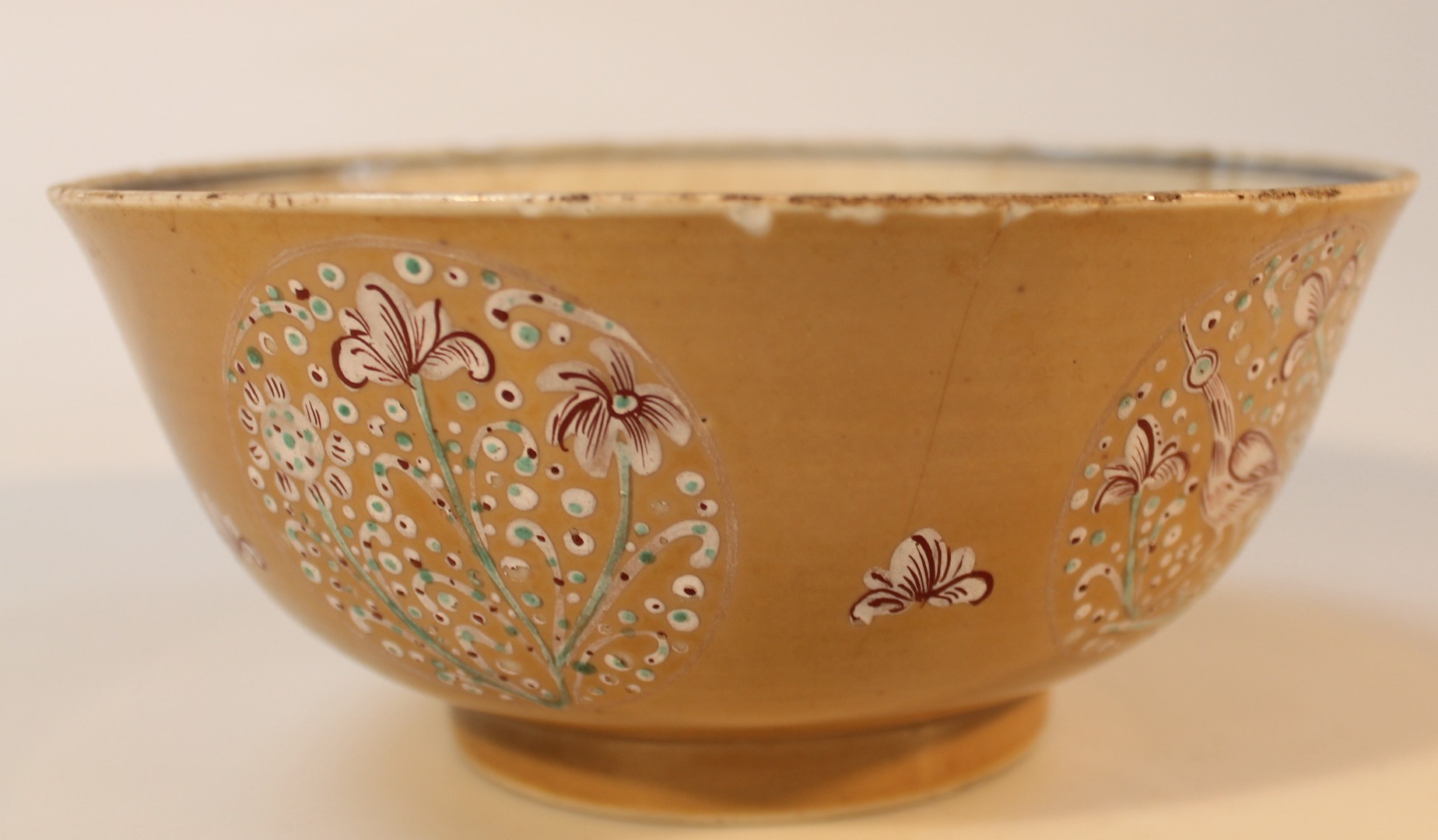 Appraisal: A porcelain brown glazed bowl with a blue and white