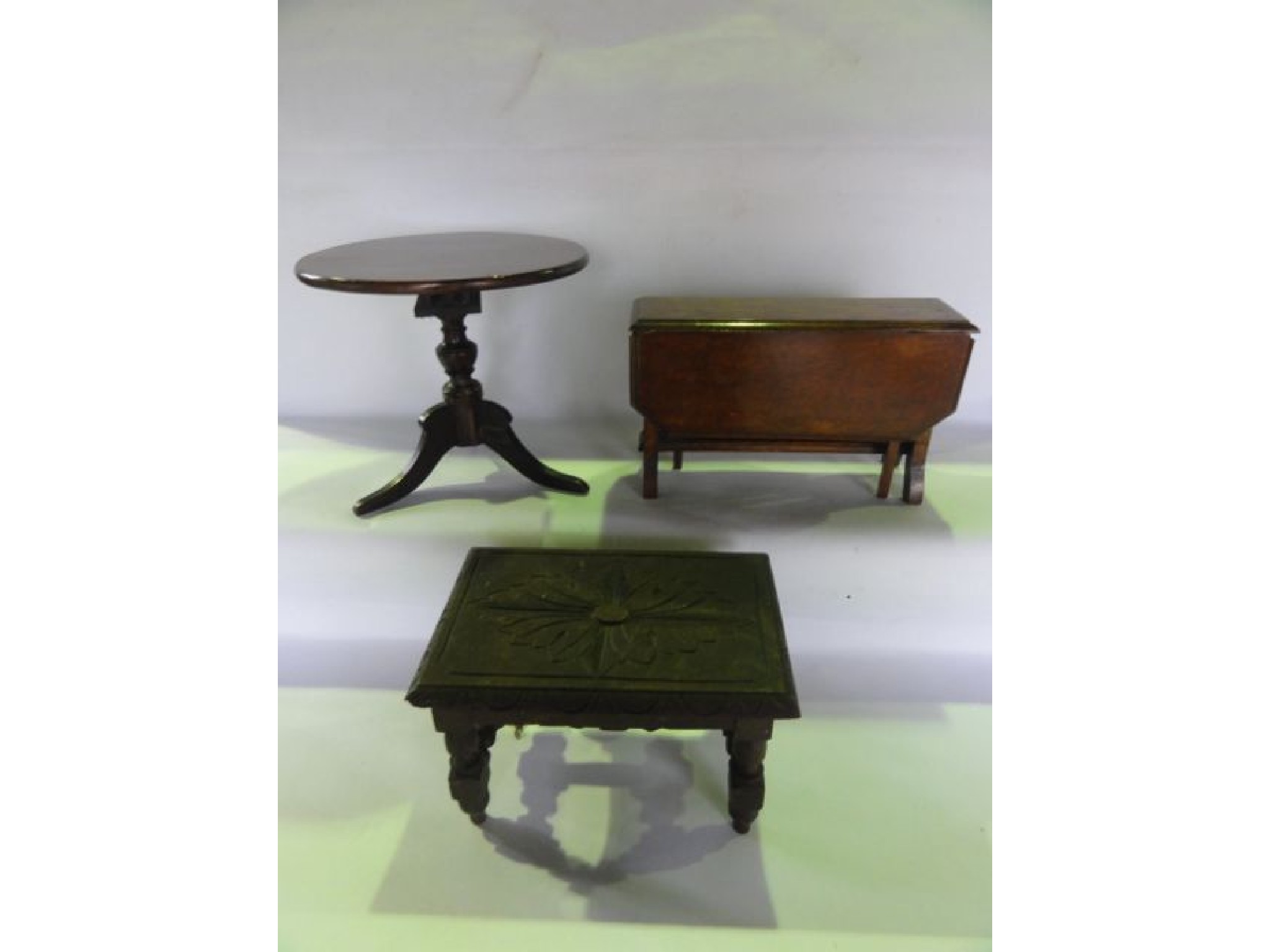 Appraisal: An antique miniature mahogany model of a Georgian occasional table