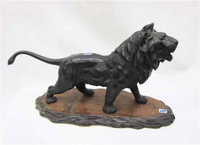 Appraisal: JAPANESE PATINATED BRONZE FIGURE depicting an African male lion standing