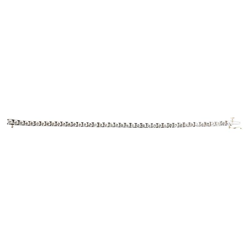 Appraisal: DIAMOND K GOLD TENNIS BRACELET RBC diamonds on box shaped