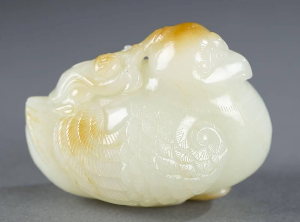 Appraisal: Chinese carved jade duck A Chinese carved jade duck White