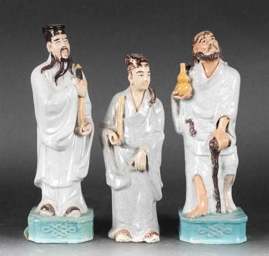 Appraisal: Three Chinese painted mud figures Estimate - All items sold