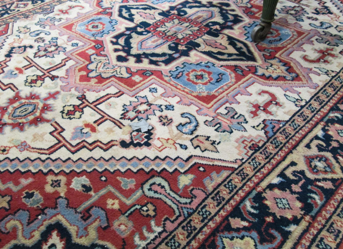 Appraisal: HAND KNOTTED ORIENTAL CARPET Persian Heriz design ' x '