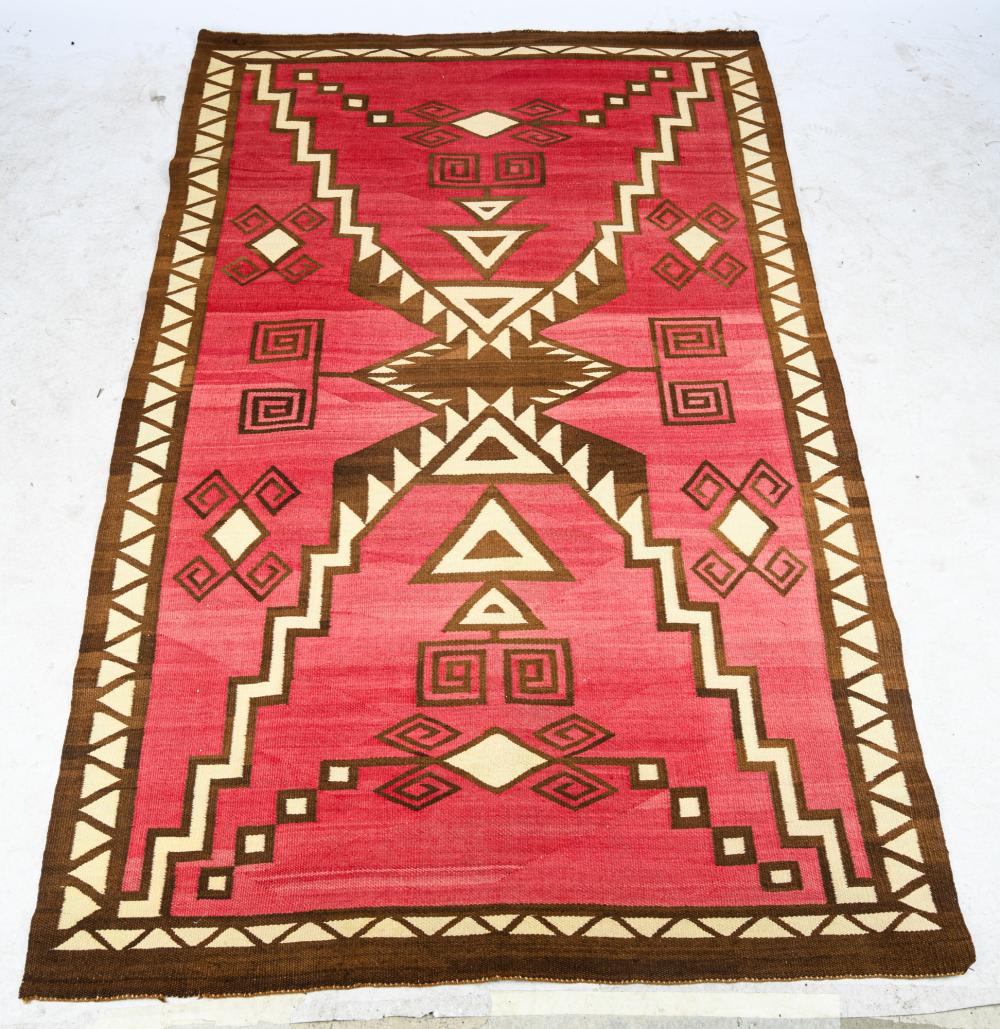 Appraisal: RED BROWN NAVAJO THROW RUGCondition with faded colors x inches