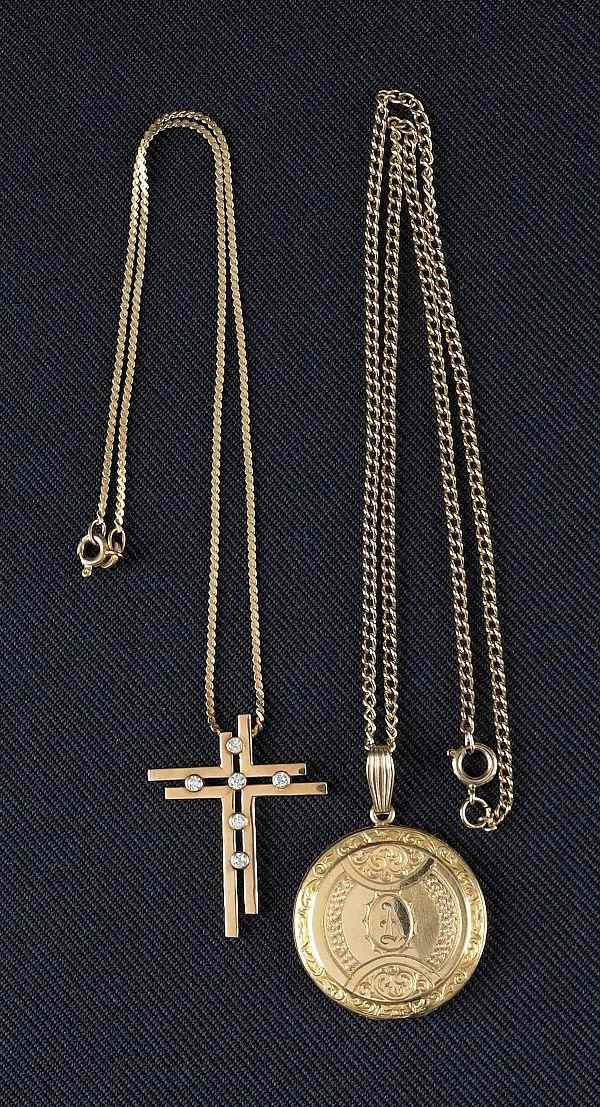 Appraisal: Two K yellow gold necklaces and pendants to include a