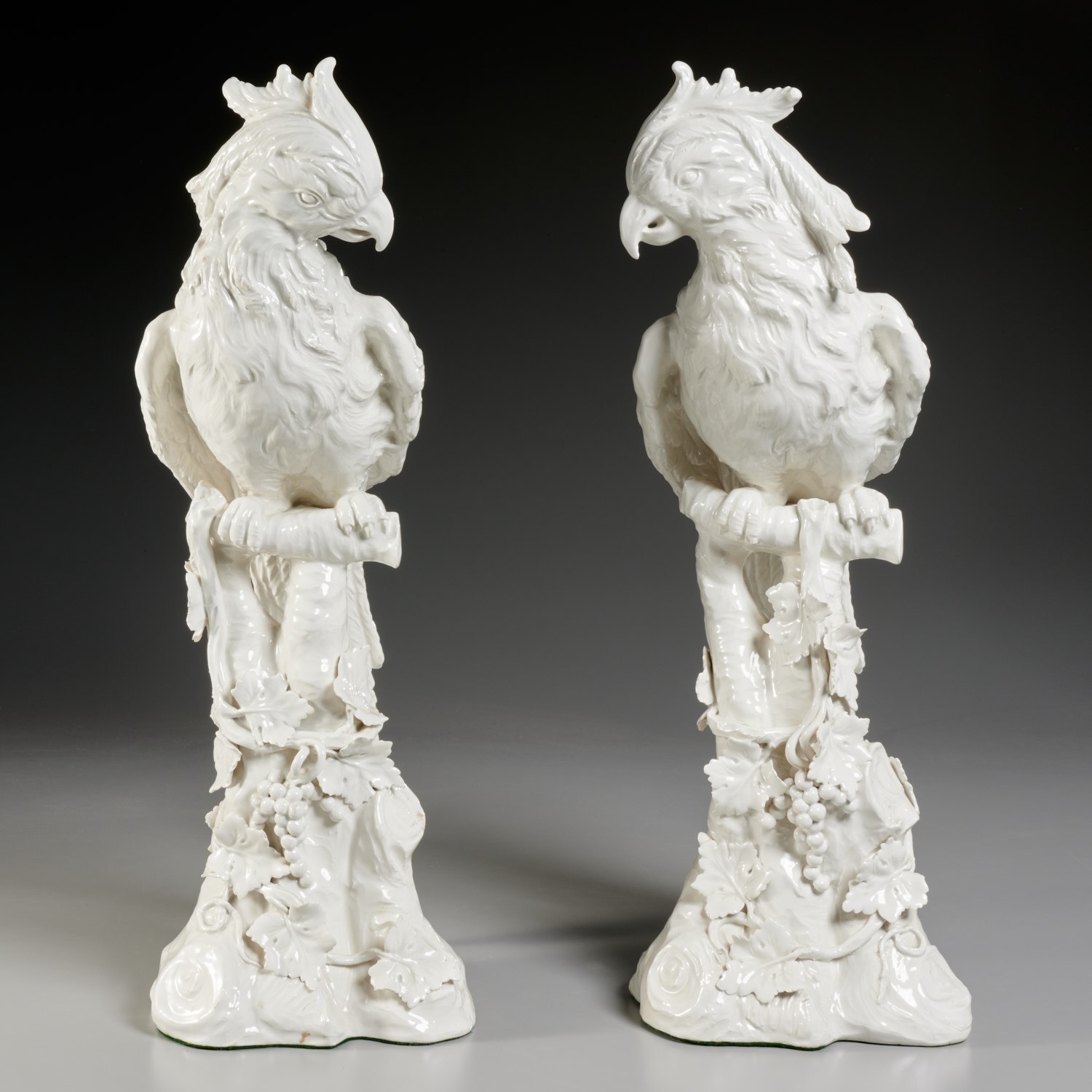 Appraisal: PAIR LARGE CONTINENTAL CREAMWARE EXOTIC BIRDS th c likely Italy