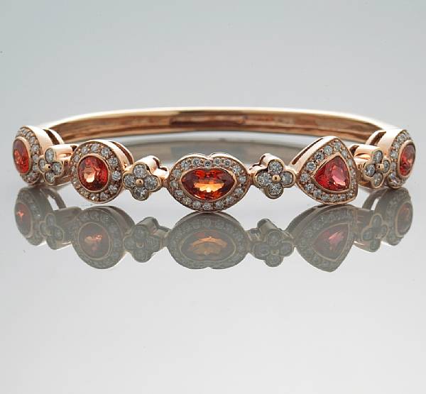 Appraisal: An orange stone and diamond bangle bracelet estimated total diamond