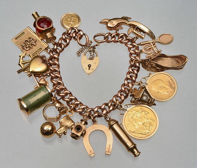 Appraisal: A CT GOLD CURB LINK BRACELET with eighteen attached charms