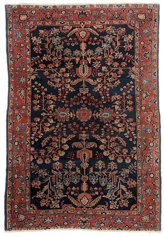 Appraisal: Sarouk Rug navy field leaf and vine pattern throughout red