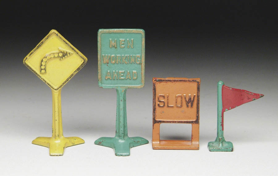 Appraisal: LOT OF ARCADE CAST IRON SIGNS Consists of Slow sign