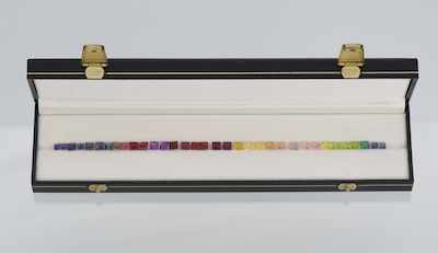 Appraisal: A Set of Color Gemstones Containing square cut gemstones including