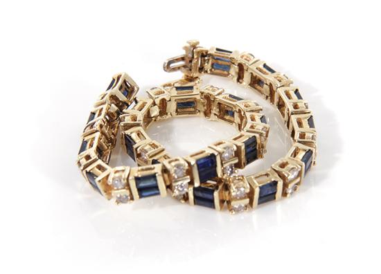 Appraisal: Sapphire and diamond bracelet double baguette-cut blue sapphires interspaced by