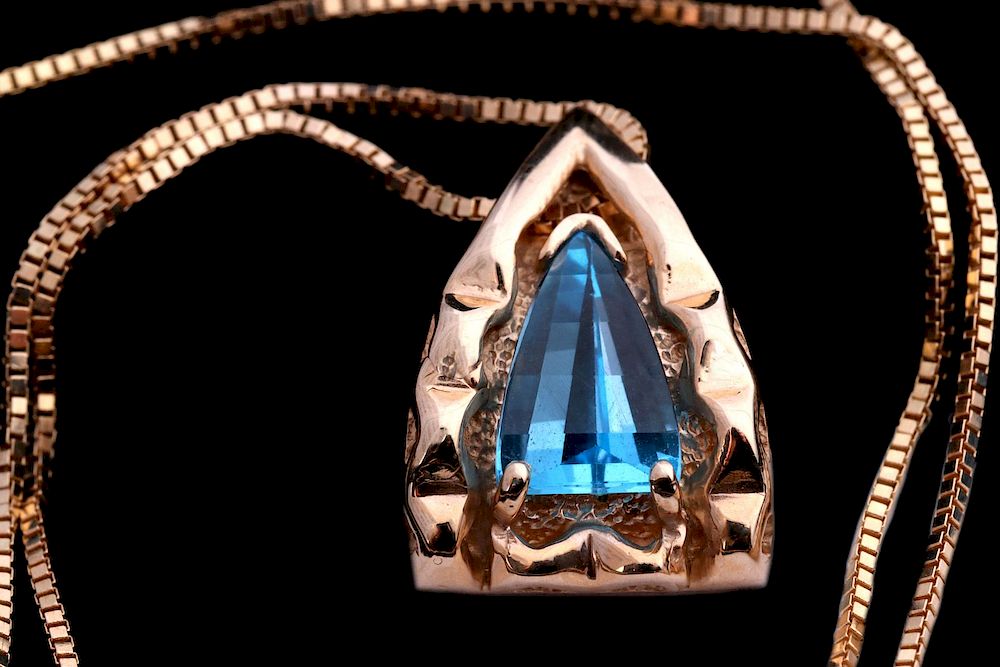 Appraisal: A K PENDANT WITH UNUSUAL FANCY CUT BLUE GEMSTONE A