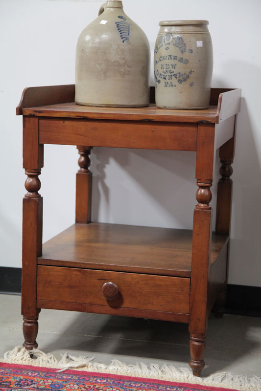 Appraisal: WASHSTAND Cherry having a shaped gallery lower shelf with a