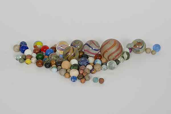 Appraisal: Marbles Assortment of early glass marbles including swirls agate cat