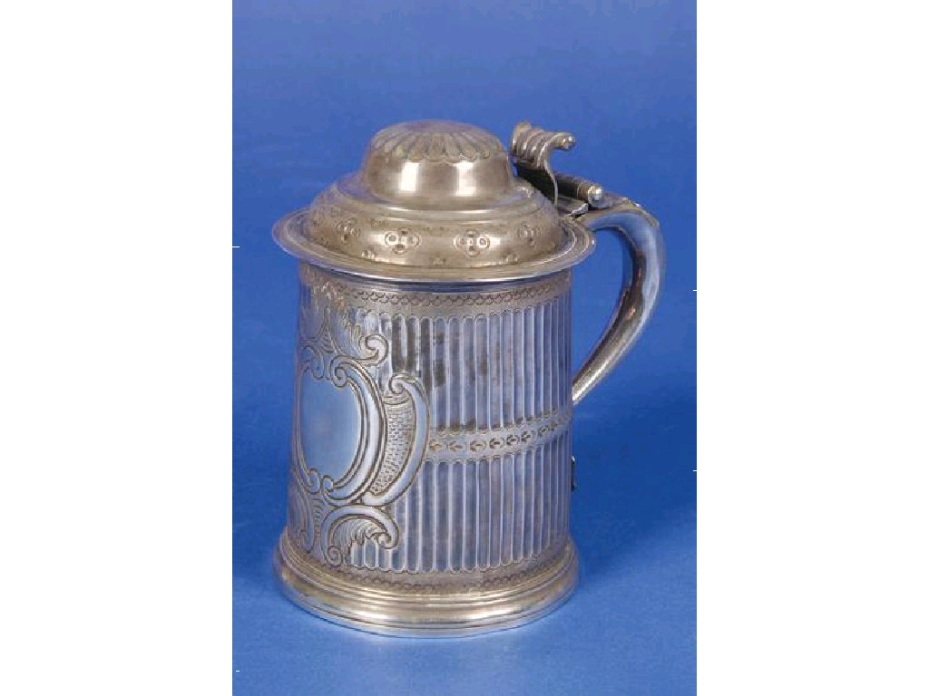 Appraisal: A QUEEN ANNE STYLE LIDDED TANKARD with a scroll thumbpiece