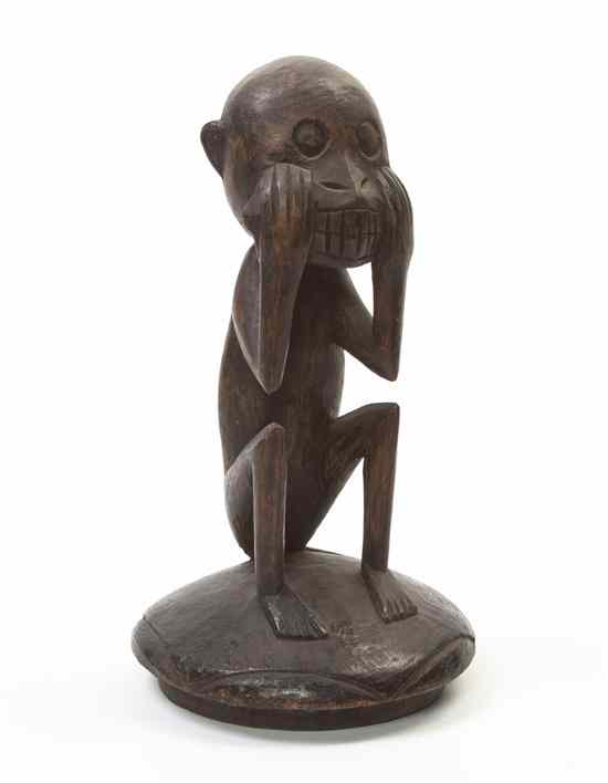 Appraisal: A Carved Wood Figural Lid West African depicting a crouching