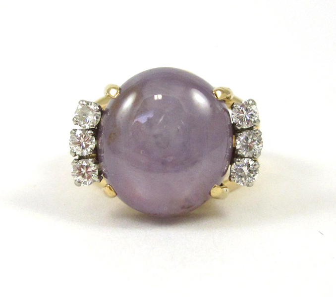 Appraisal: STAR SAPPHIRE AND DIAMOND RING The k yellow gold ring