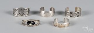 Appraisal: Four Southwestern Native American sterling silver cuff bracelets together with