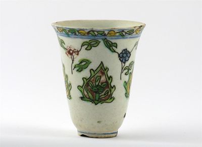 Appraisal: A Kutahya pottery beaker with a slender body flaring towards