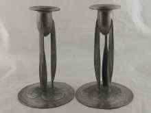 Appraisal: A pair of Art Nouveau pewter candle sticks approx cm