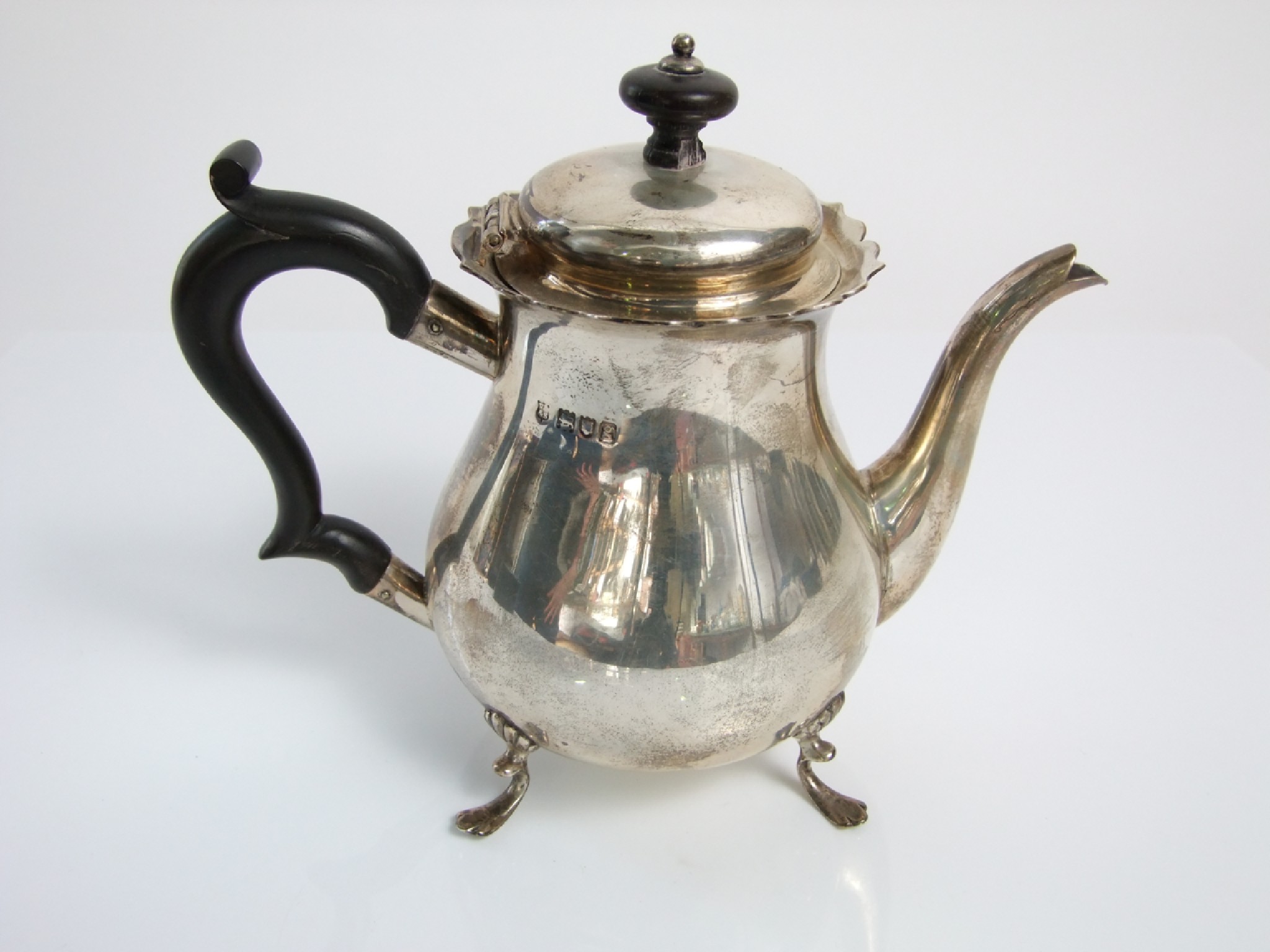 Appraisal: A silver coffee pot the body of pear shape raised