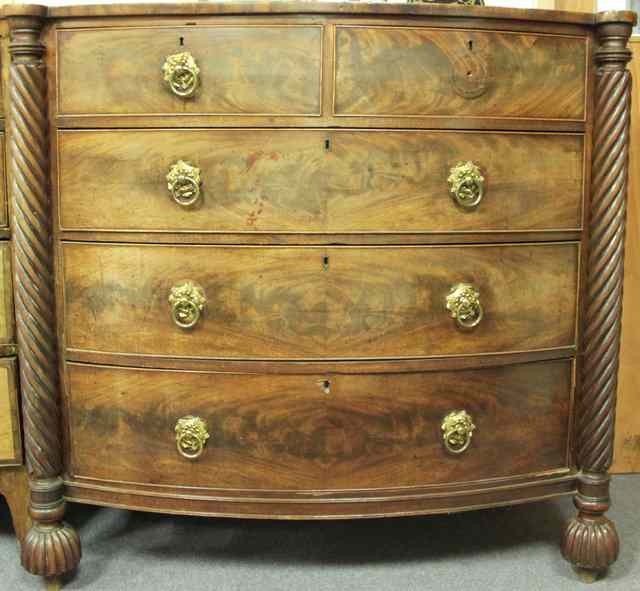 Appraisal: An early th Century mahogany bowfront chest of three long