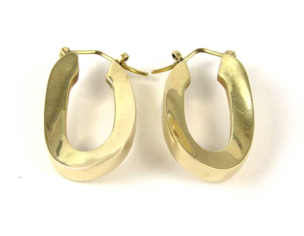 Appraisal: PAIR OF FOURTEEN KARAT GOLD EARRINGS each wide oval hoop