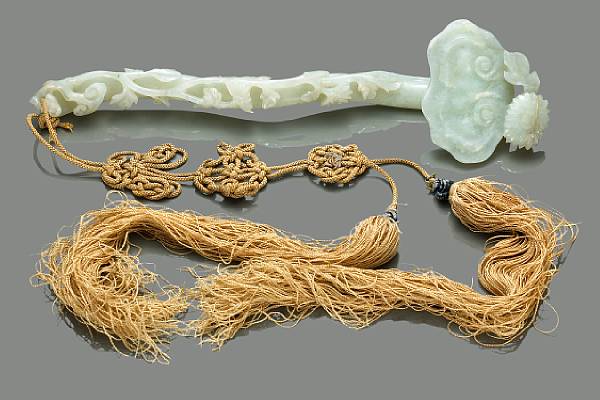 Appraisal: A pale greenish-white jade ruyi scepter Modeled as a lingzhi