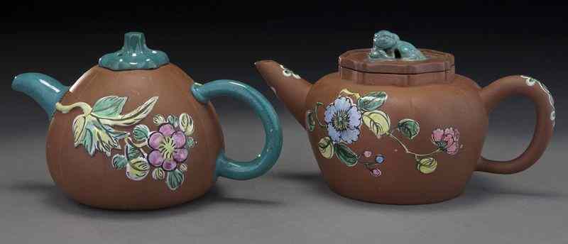 Appraisal: Chinese Yixing teapots depicting pumpkinsand plum blossoms ''H x ''W