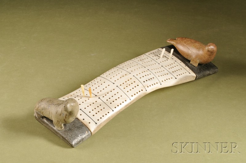 Appraisal: Inuit Stone and Antler Cribbage Board with carved seals resting