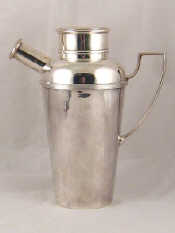 Appraisal: A silver plated cocktail shaker with handle and filter spout