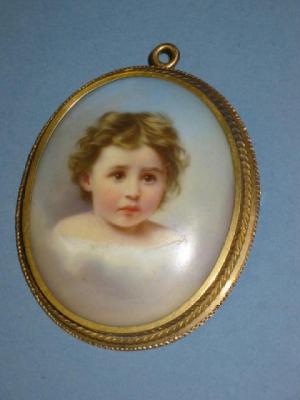 Appraisal: A PORCELAIN BROOCH the oval panel painted with a portrait