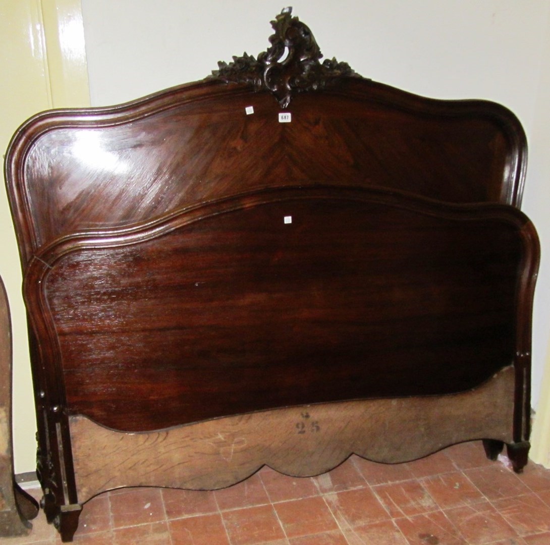 Appraisal: A Louis XV style rosewood double bed with scroll carved