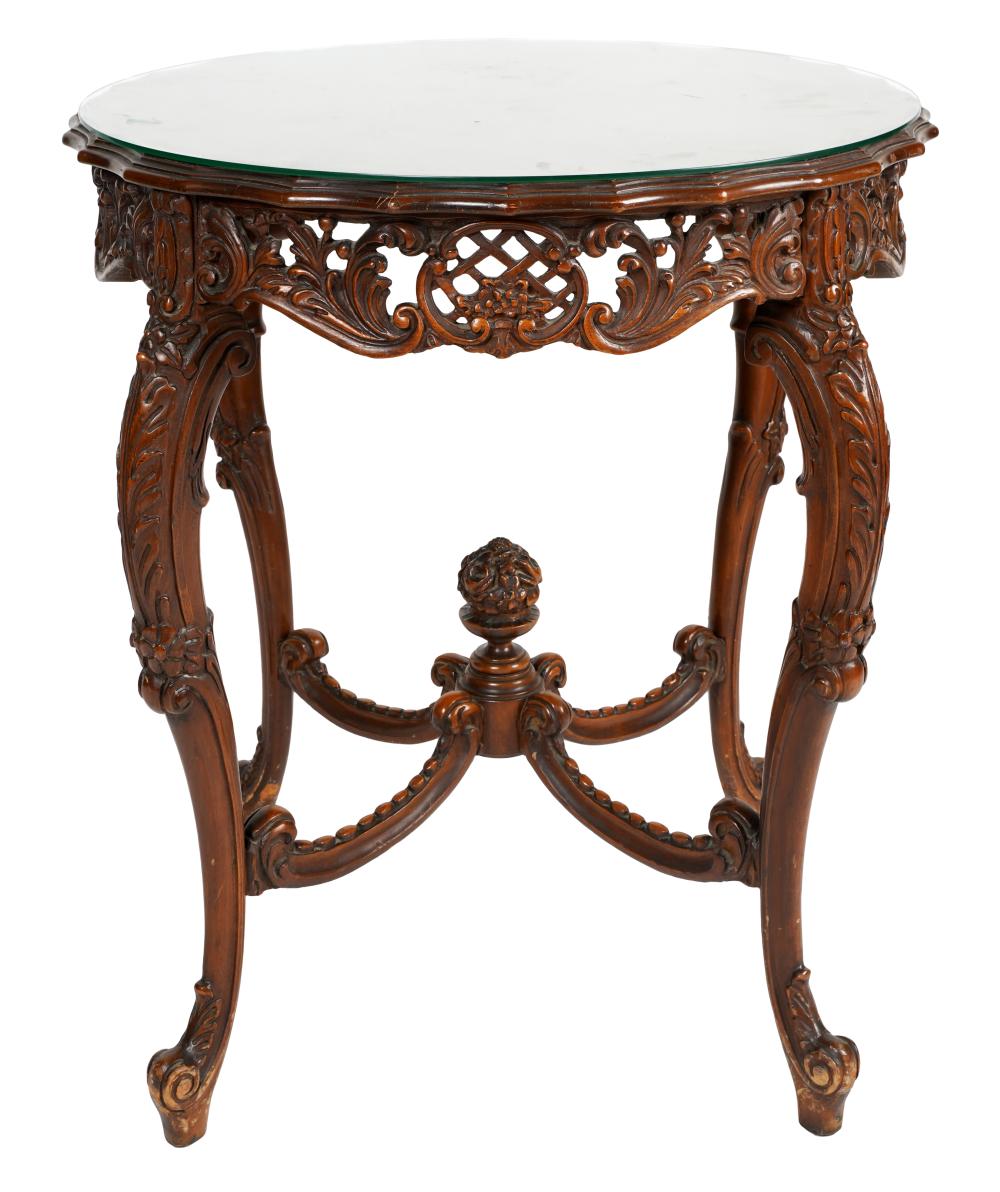 Appraisal: VICTORIAN CARVED WALNUT CENTER TABLEwith marquetry-inlaid top Provenance The E