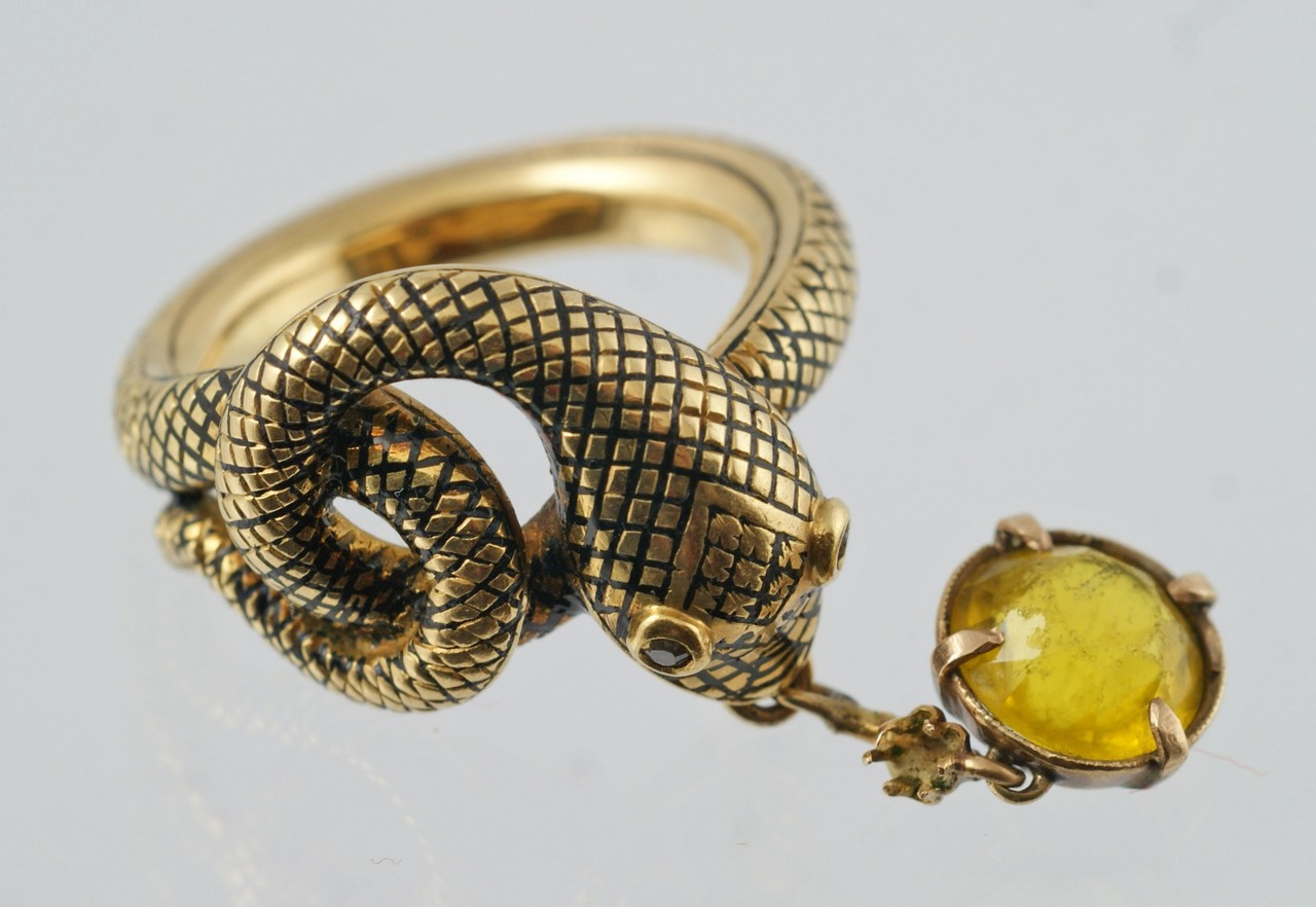 Appraisal: Unmarked K YG snake ring with diamond eyes pendant from